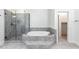 Bathroom with large soaking tub and tiled walk-in shower at 83 Calabria Ct, Clayton, NC 27527