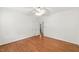 Bright bedroom featuring hardwood floors, ceiling fan, and neutral paint at 83 Calabria Ct, Clayton, NC 27527