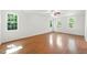 Bright and airy bedroom with hardwood floors and large windows providing ample natural light and views at 83 Calabria Ct, Clayton, NC 27527