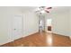 Bedroom with hardwood flooring, neutral walls, and ensuite bathroom entrance at 83 Calabria Ct, Clayton, NC 27527