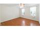 Bright bedroom featuring hardwood floors and large windows at 83 Calabria Ct, Clayton, NC 27527