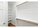 Walk-in closet featuring custom built-in shelving at 83 Calabria Ct, Clayton, NC 27527