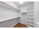 Walk-in closet with built-in shelving and ample storage space at 83 Calabria Ct, Clayton, NC 27527