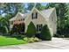 A charming brick home surrounded by lush landscaping and a well-manicured lawn at 83 Calabria Ct, Clayton, NC 27527