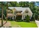 Charming brick home with a well-maintained lawn and mature landscaping at 83 Calabria Ct, Clayton, NC 27527