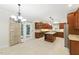 Gourmet kitchen with cherry wood cabinets, stainless steel appliances, granite countertops and an oversized kitchen island at 83 Calabria Ct, Clayton, NC 27527