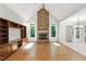 Spacious living room with fireplace, vaulted ceilings, hardwood floors, and large built-ins at 83 Calabria Ct, Clayton, NC 27527