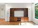 Close up of a custom built-in entertainment center with beautiful detailing and ample storage in the living room at 83 Calabria Ct, Clayton, NC 27527