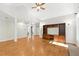 Spacious living room with high vaulted ceilings, hardwood floors, and a custom built-in entertainment center at 83 Calabria Ct, Clayton, NC 27527