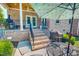 Inviting brick patio with steps leading to a covered porch, perfect for outdoor entertaining at 90 S Old Lantern Rd, Timberlake, NC 27583