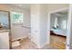 Bright bathroom featuring glass enclosed shower, tile flooring, and access to the main bedroom at 90 S Old Lantern Rd, Timberlake, NC 27583