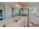 Bright bathroom featuring double vanity, glass enclosed shower and large mirror at 90 S Old Lantern Rd, Timberlake, NC 27583