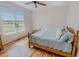 Bright bedroom with hardwood floors, window and ceiling fan at 90 S Old Lantern Rd, Timberlake, NC 27583