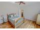 Bedroom featuring hardwood floors, a ceiling fan, and a doorway to another room at 90 S Old Lantern Rd, Timberlake, NC 27583