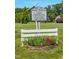 Holeman Plantation sign showing Oakland's history surrounded by a white fence at 90 S Old Lantern Rd, Timberlake, NC 27583