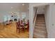 Open-concept dining room with a table, chairs, and hardwood floors at 90 S Old Lantern Rd, Timberlake, NC 27583