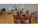 Open concept dining room with hardwood floors and view of living spaces at 90 S Old Lantern Rd, Timberlake, NC 27583