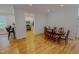 Charming dining room adjacent to the kitchen with wood floors and modern lighting at 90 S Old Lantern Rd, Timberlake, NC 27583