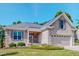 Charming single-Gathering home featuring a brick facade, well-manicured lawn, and attached two-car garage at 90 S Old Lantern Rd, Timberlake, NC 27583