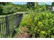 Garden area showing plants growing along fence line and treed area at 90 S Old Lantern Rd, Timberlake, NC 27583