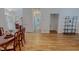 Hallway with hardwood floors offering an open view into other rooms of the home at 90 S Old Lantern Rd, Timberlake, NC 27583