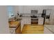 Well-equipped kitchen with granite countertops, stainless appliances, and modern cabinetry at 90 S Old Lantern Rd, Timberlake, NC 27583
