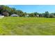 Expansive, meticulously kept lawn with trees and lovely homes in the background at 90 S Old Lantern Rd, Timberlake, NC 27583