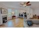 Bright and airy living room with hardwood floors, fireplace, and seamless connection to the modern kitchen at 90 S Old Lantern Rd, Timberlake, NC 27583
