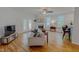 Comfortable living room featuring hardwood floors, a fireplace, and abundant natural light at 90 S Old Lantern Rd, Timberlake, NC 27583