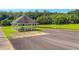Outdoor pavilion by a pond with picnic tables and lovely green spaces for community enjoyment at 90 S Old Lantern Rd, Timberlake, NC 27583