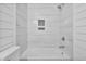 Updated bathroom featuring marble style tile on the walls and shower at 904 Lanier Farm Rd, Sanford, NC 27330