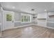 Beautifully designed entryway with light gray walls, modern flooring, and a glass panel door at 904 Lanier Farm Rd, Sanford, NC 27330