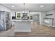 Bright and open kitchen with stainless steel appliances, granite countertops, and white cabinets at 904 Lanier Farm Rd, Sanford, NC 27330