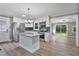 Beautiful kitchen with white cabinets, granite countertops, stainless steel appliances, and a center island at 904 Lanier Farm Rd, Sanford, NC 27330