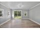Bright and airy living room with sliding glass doors and new floors at 904 Lanier Farm Rd, Sanford, NC 27330