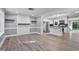 Open-concept living room and kitchen with modern flooring and neutral paint, perfect for entertaining at 904 Lanier Farm Rd, Sanford, NC 27330