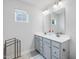 Bright bathroom features a double vanity, large mirrors, and modern fixtures at 100 Haddonfield Ct, Franklinton, NC 27525