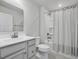 Clean bathroom features a modern vanity, toilet, and a shower with a stylish curtain at 100 Haddonfield Ct, Franklinton, NC 27525