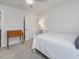 Cozy bedroom features a simple desk, and modern white bed with a peaceful atmosphere at 100 Haddonfield Ct, Franklinton, NC 27525