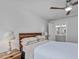Bright bedroom with a wood headboard, ceiling fan, and access to an ensuite bathroom at 100 Haddonfield Ct, Franklinton, NC 27525