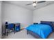 Comfortable bedroom features a modern desk, ceiling fan, and lots of natural light at 100 Haddonfield Ct, Franklinton, NC 27525