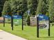 Community signs advertise lawn care, a future dog park, and firepit at 100 Haddonfield Ct, Franklinton, NC 27525
