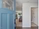 Inviting home entryway featuring a teal front door and a view into the spacious living area at 100 Haddonfield Ct, Franklinton, NC 27525