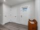 Bright foyer with light wood-look flooring, white trim, and convenient access to the front door at 100 Haddonfield Ct, Franklinton, NC 27525