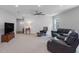 Bright living room with recessed lights and comfortable leather seating at 100 Haddonfield Ct, Franklinton, NC 27525