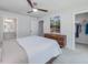 A spacious main bedroom with ensuite bath and walk-in closet, featuring natural light and ceiling fan at 100 Haddonfield Ct, Franklinton, NC 27525