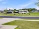 View of a neighborhood common area featuring a white pergola and manicured green space at 100 Haddonfield Ct, Franklinton, NC 27525