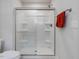 Modern shower with glass doors, built-in shelving, and sleek hardware at 100 Haddonfield Ct, Franklinton, NC 27525