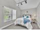 Cozy bedroom featuring soft carpet, comfortable bedding, natural light, and a serene ambiance at 101 Ferndale Ct, Clayton, NC 27520