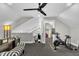 Spacious bonus room featuring a ceiling fan, sitting area, and exercise equipment at 101 Ferndale Ct, Clayton, NC 27520